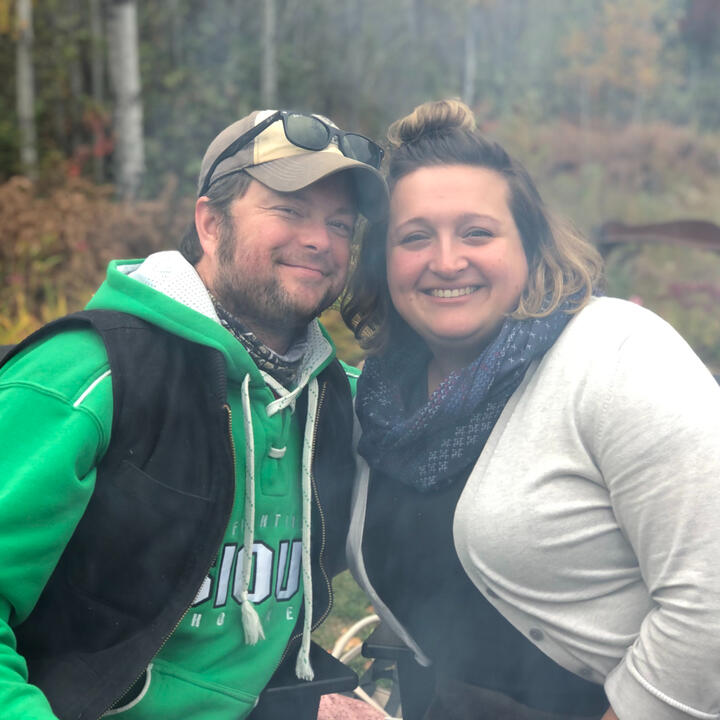 Hannah and Erik smiling together in autumn