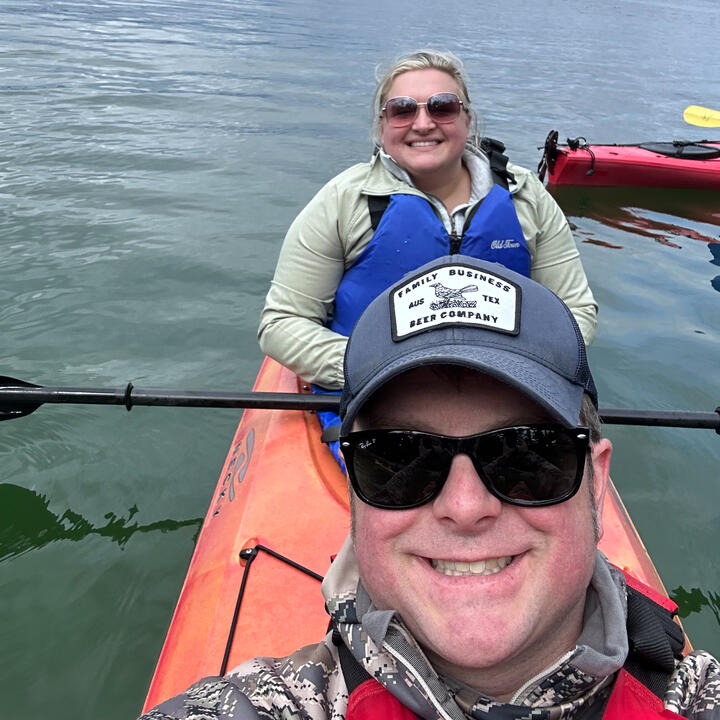 Hannah & Erik kayaking together in Alaska