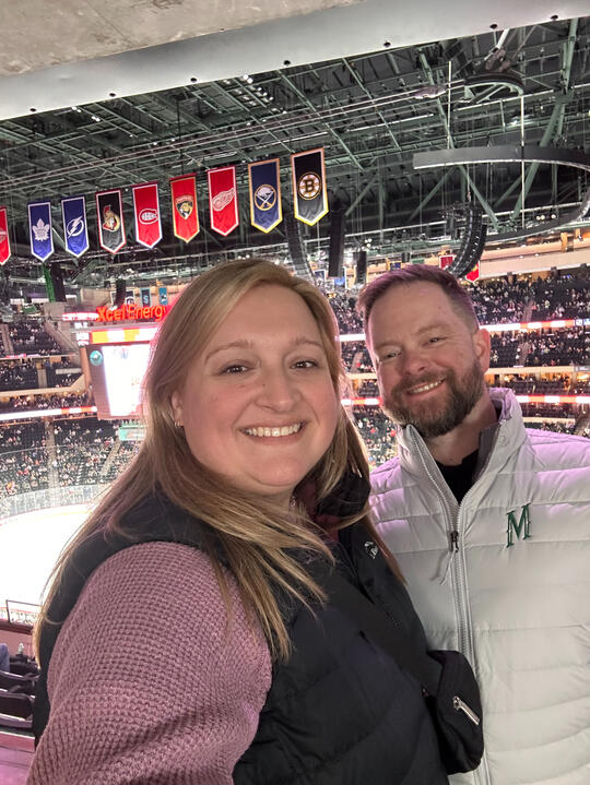 Hannah and Erik enjoying a hockey game together