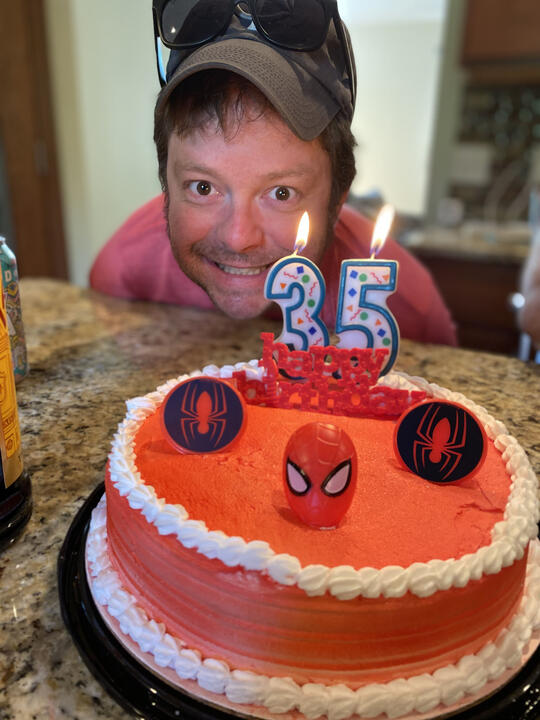 Erik celebrating his birthday with a Spider-Man cake