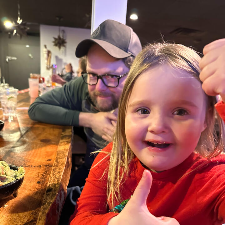 Erik and niece eating dinner together at the bar
