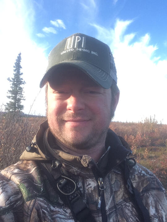 Erik taking a selfie during a hunting trip