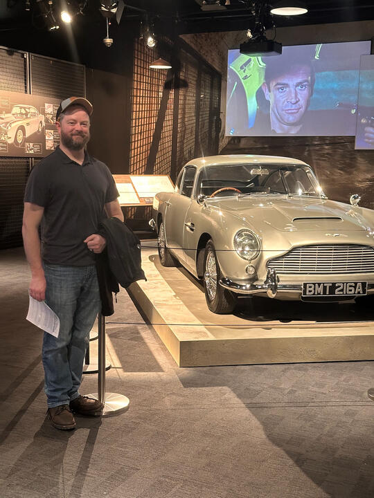 Erik next to James Bonds' Austin Martin DB5