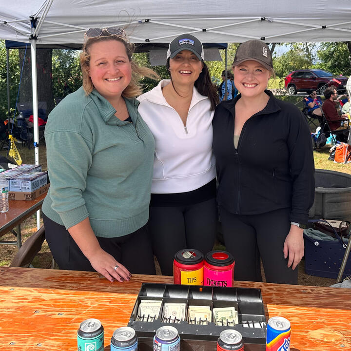 Hannah volunteering alongside friends during a community event