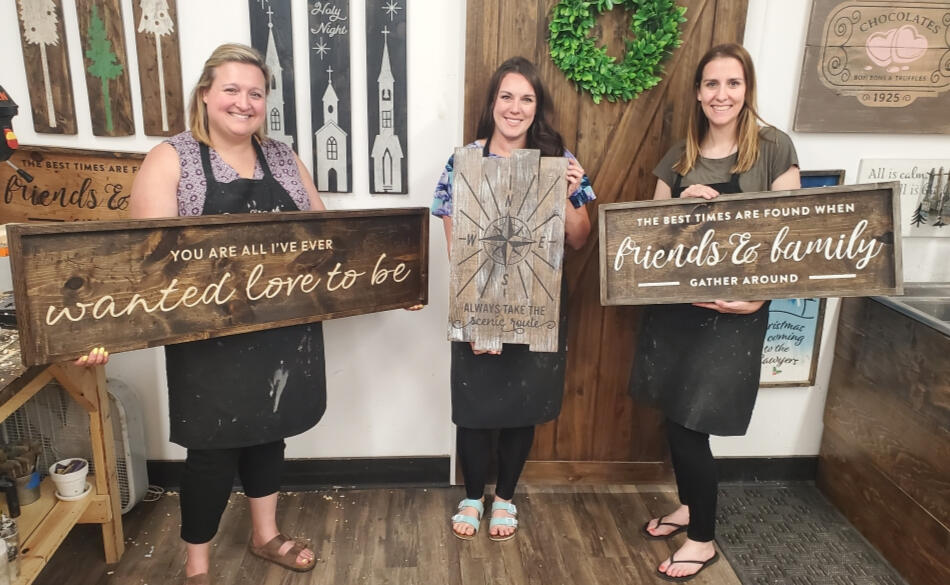 Hannah with friends at a Board &amp; Brush craft event