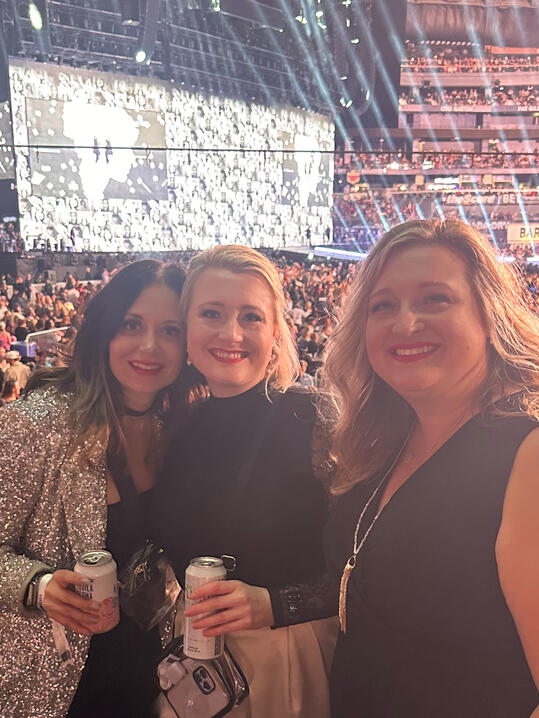 Hannah enjoying Taylor Swift concert with friends