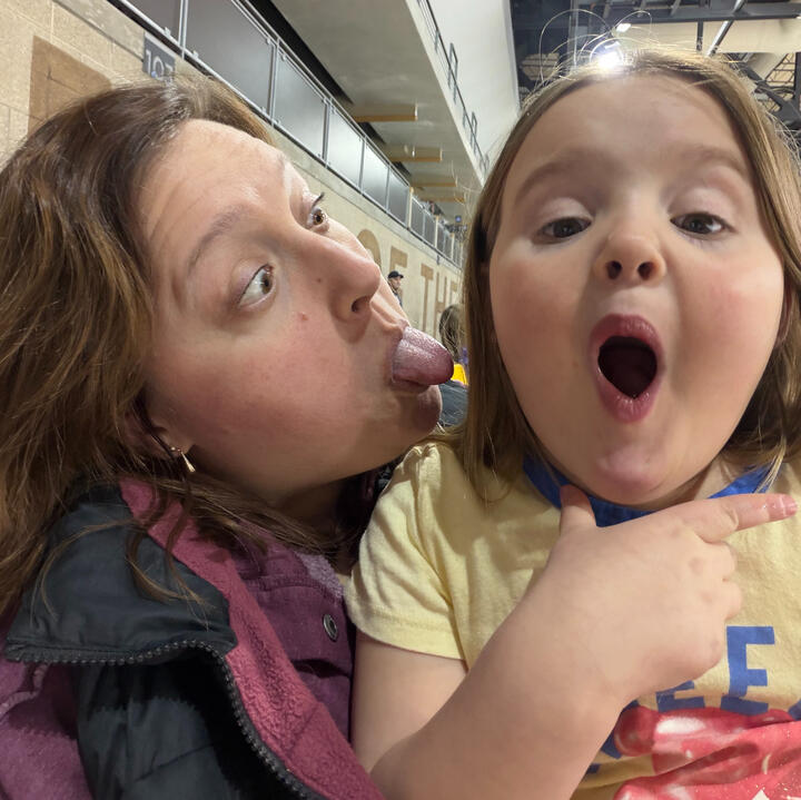 Hannah making a silly face with her young niece during a