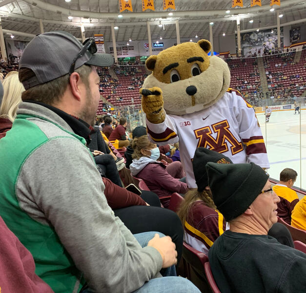 Goldie making fun of Erik's shirt at the UMN Hockey Game