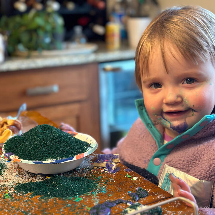 Young niece enjoying Christmas cookie decorating