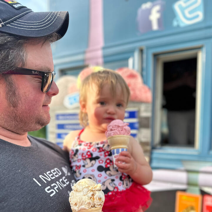 Erik holding niece and eating ice cream cones
