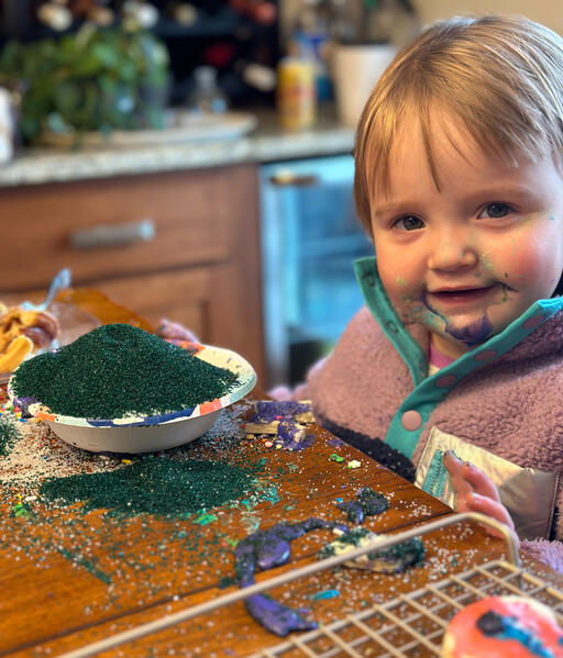Ev decorating cookies with ALL of the sprinkles!