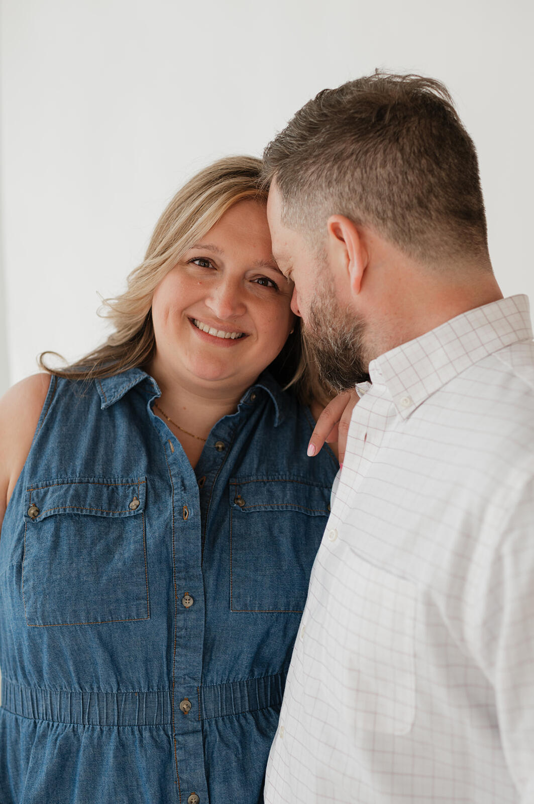 Hannah smiling during a candid moment with Erik in their adoption profile session