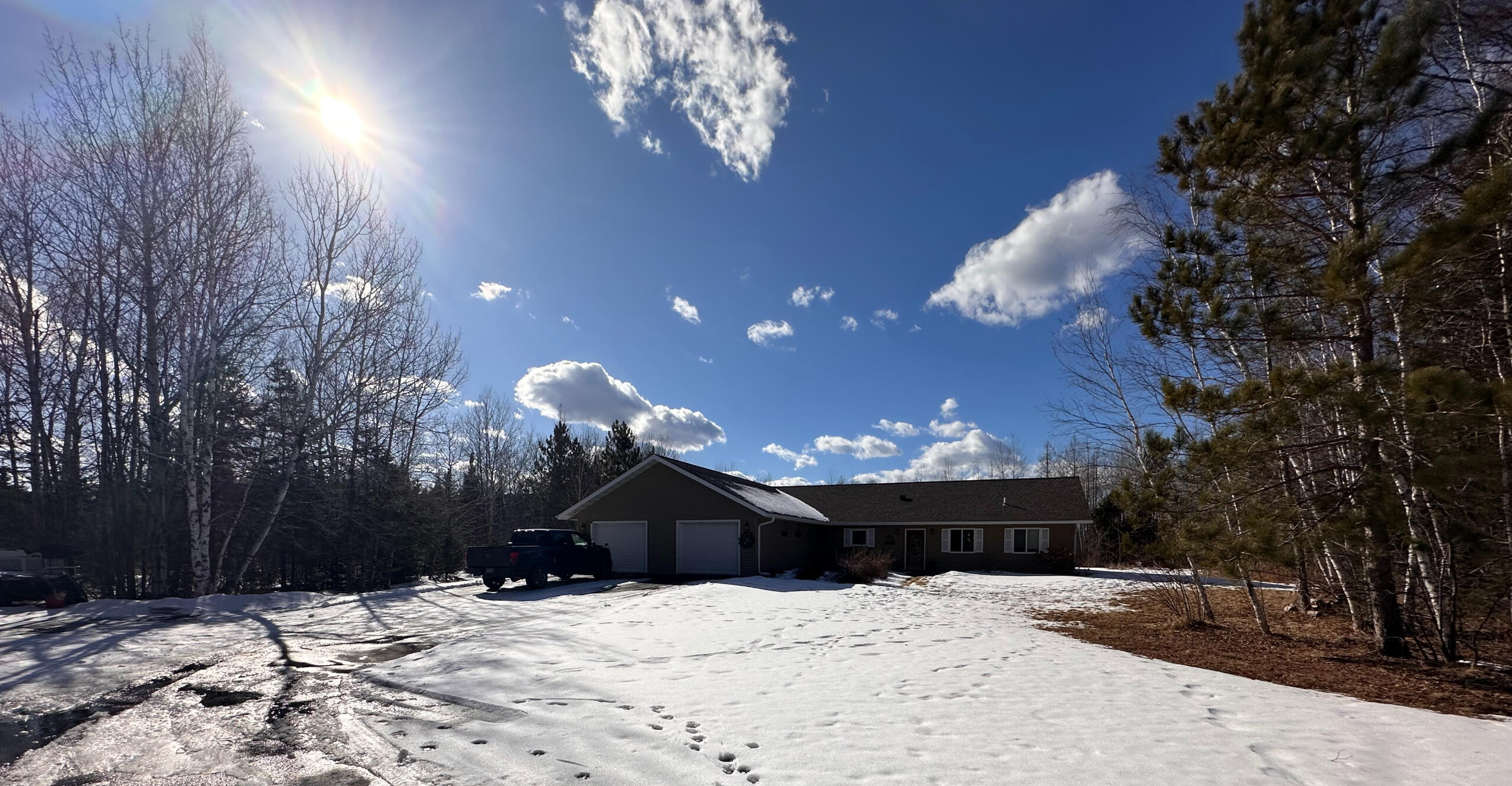 Our Home Winter 2025 Hannah and Erik's family home nestled among trees in Northern Minnesota